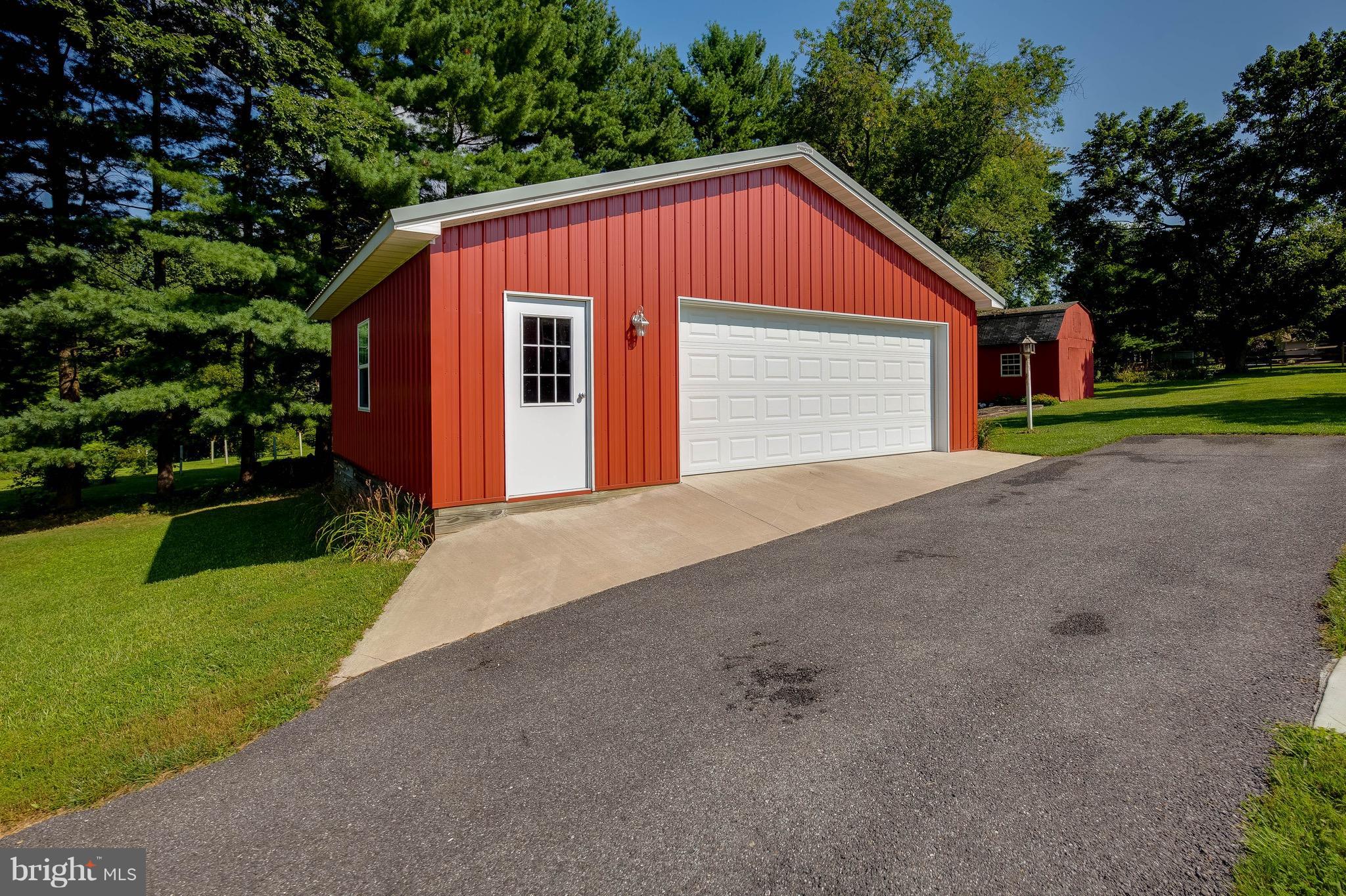 2305 Darlene Road Hampstead, MD 21074 - Photo 24 of 26 Over sized 2 car garage w/lots of storage cabinets