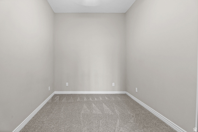 4117 North Wolf Ridge Circle Eden, UT 84310 - Photo 37 of 63 Room featuring neutral-toned walls, gray patterned carpeting, white baseboards, and a ceiling light fixture
