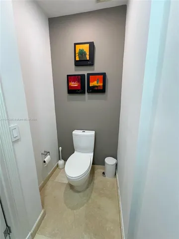 a bathroom with a toilet and a sink