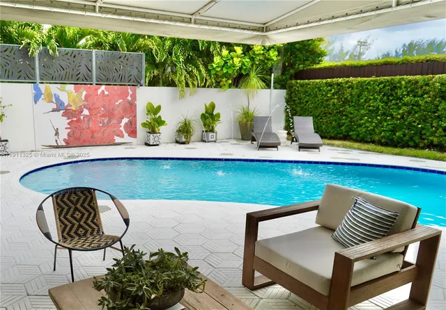 a view of swimming pool with a lounge chair