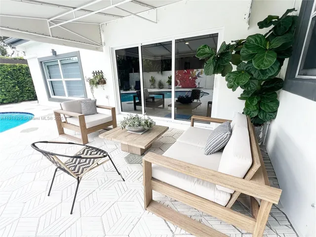a view of a dining room with furniture window and outside view