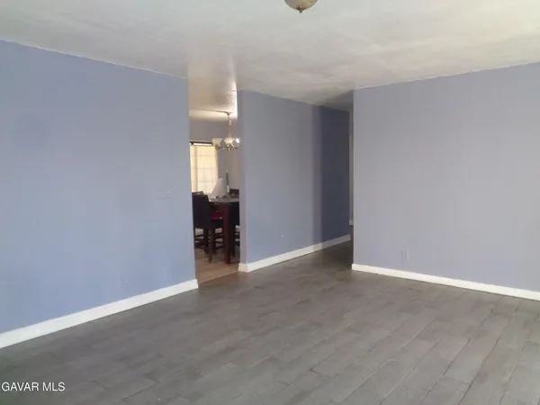 a view of a livingroom with wooden floor