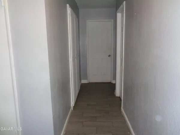 a view of a hallway with a white walls