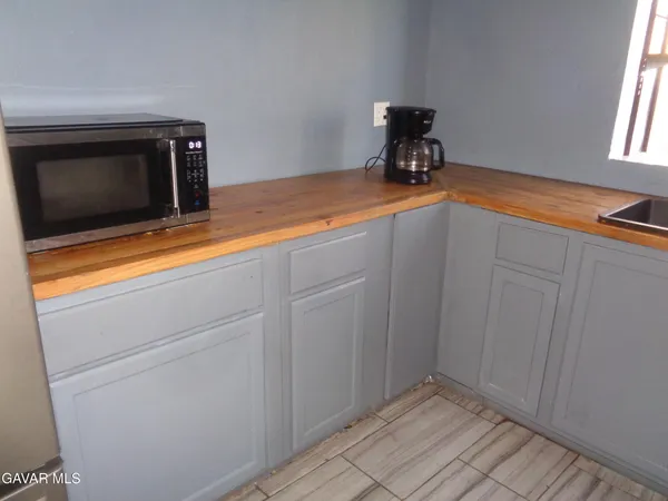 a kitchen with a sink and a microwave