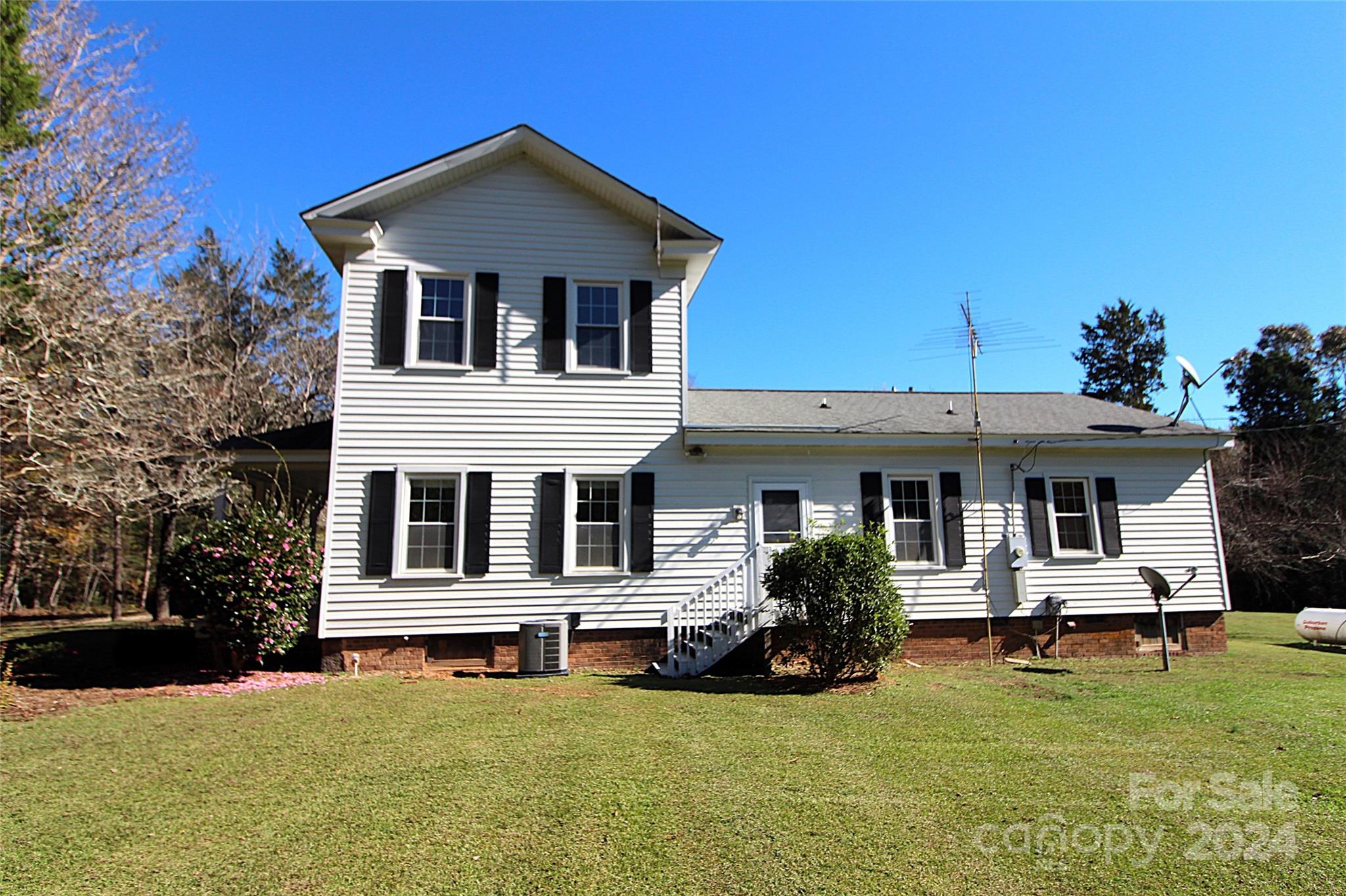 2002 Edge Park Road Clover, SC 29710 - Photo 2 of 25 a white house with a large pool in front of it
