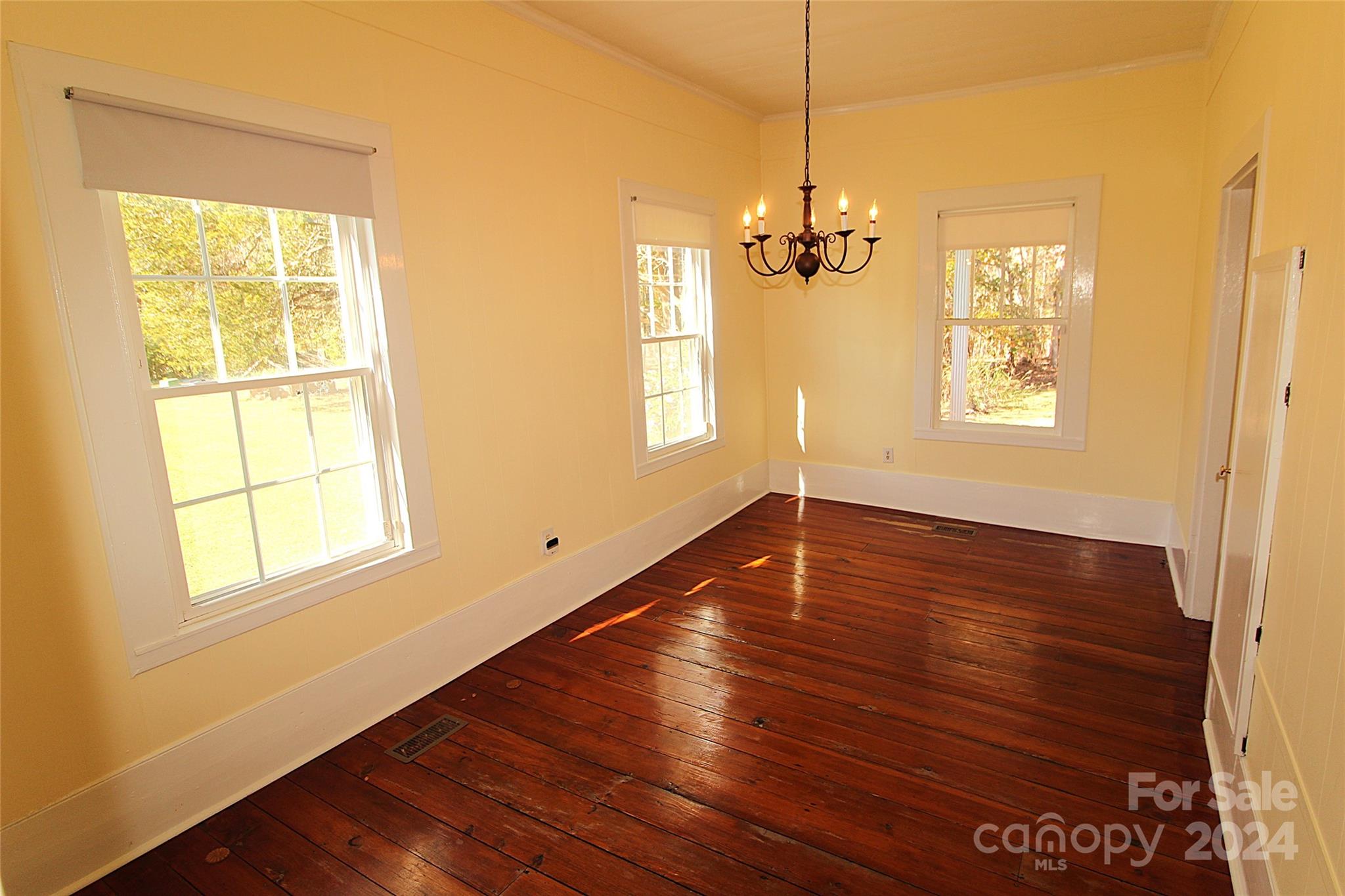 2002 Edge Park Road Clover, SC 29710 - Photo 6 of 25 a view of an empty room with wooden floor and a window