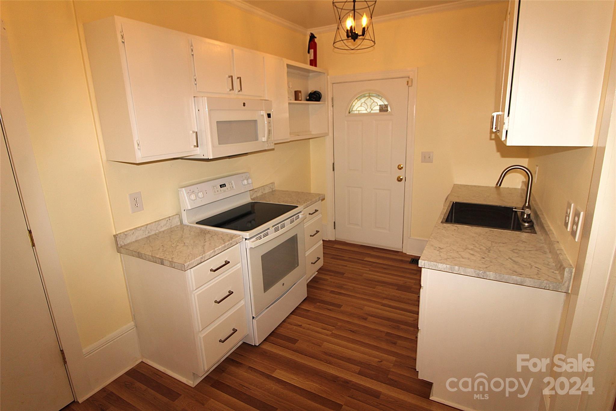 2002 Edge Park Road Clover, SC 29710 - Photo 8 of 25 a kitchen with granite countertop white cabinets and white appliances