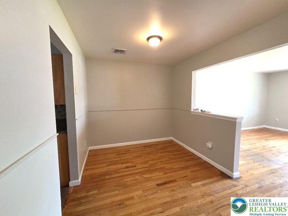 1747 Schoenersville Road Bethlehem, PA 18018 - Photo 4 of 13 Well-lit room with gleaming hardwood floors, ideal for intimate dining.