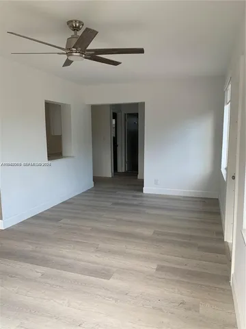 a view of a hallway with a window