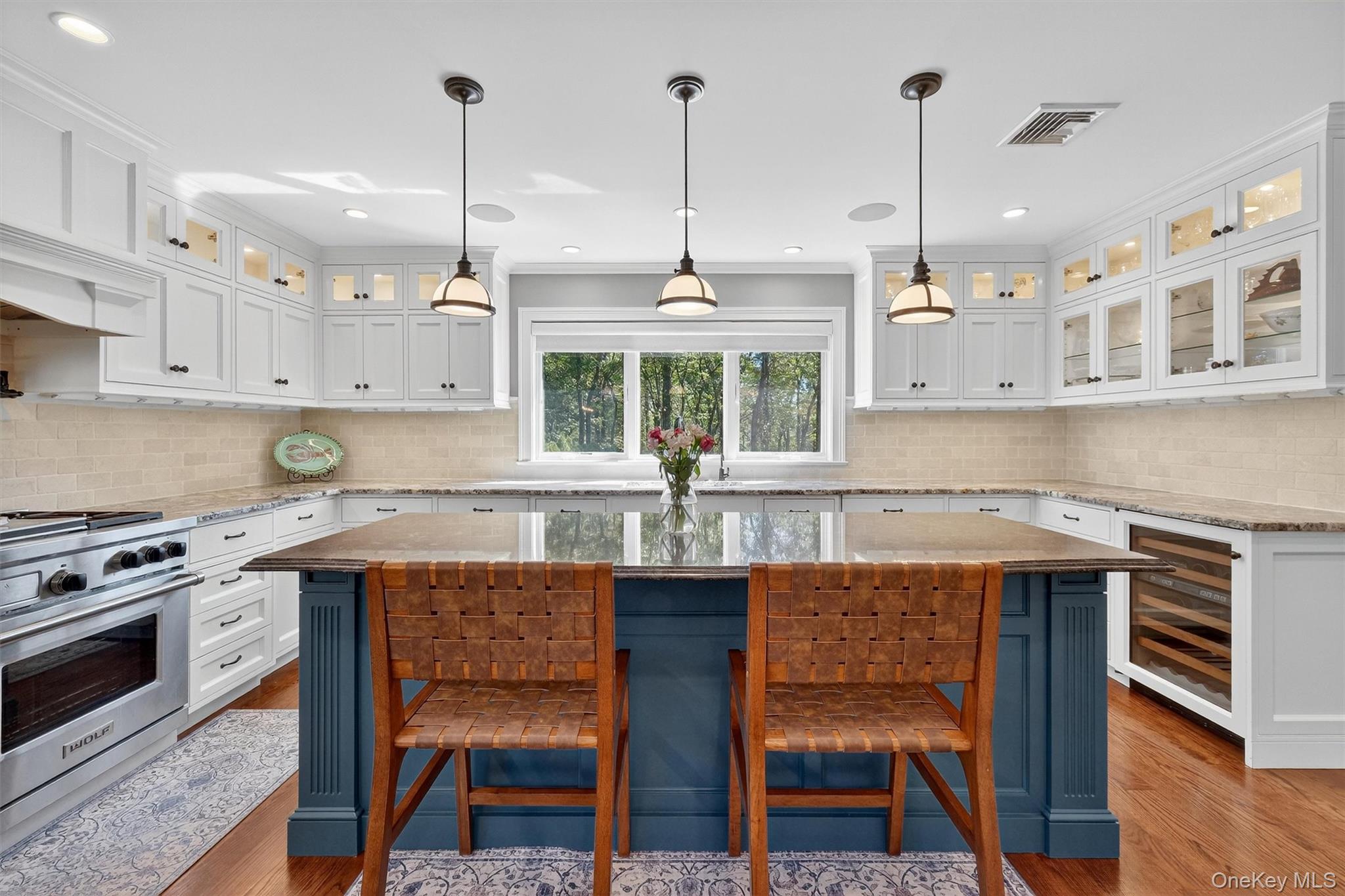 5 Stonehaven Road West Nyack, NY 10994 - Photo 12 of 50 a kitchen with stainless steel appliances granite countertop a stove a sink island and a wooden cabinets
