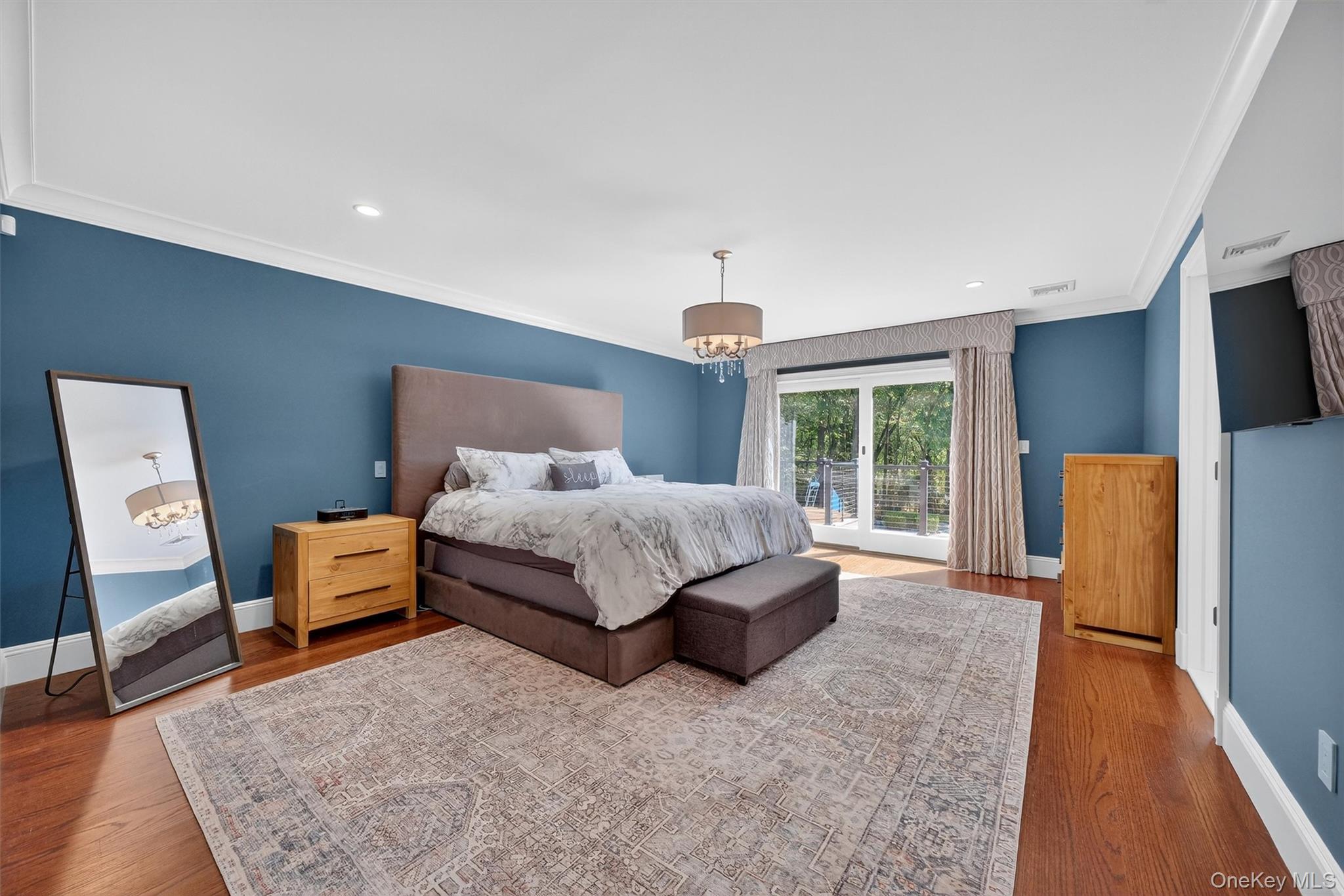 5 Stonehaven Road West Nyack, NY 10994 - Photo 17 of 50 a spacious bedroom with a bed and wooden floor