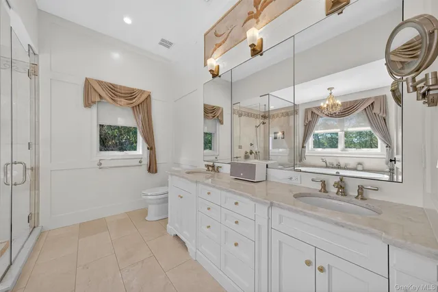 a bedroom with a bed wooden floor and window