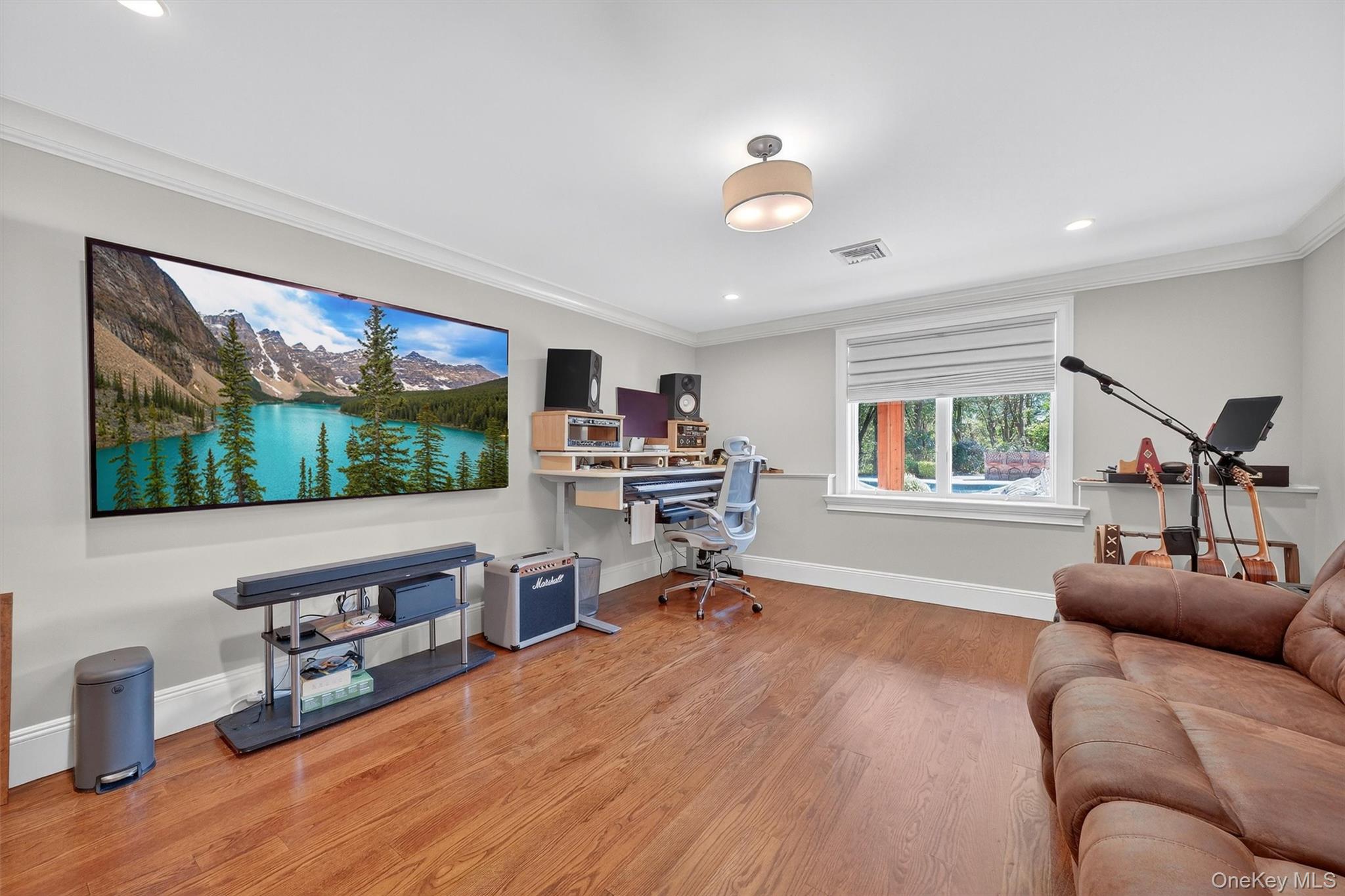 5 Stonehaven Road West Nyack, NY 10994 - Photo 27 of 50 a living room with furniture and a flat screen tv