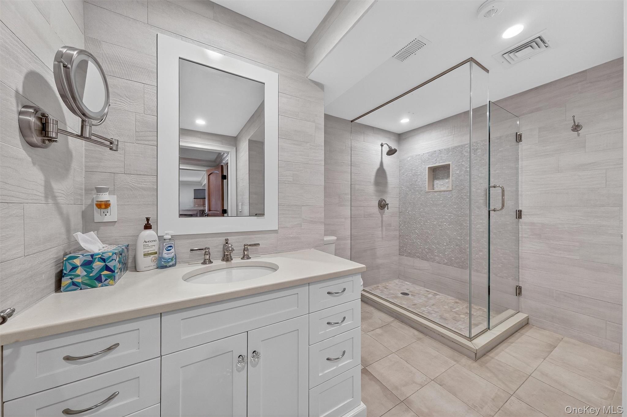 5 Stonehaven Road West Nyack, NY 10994 - Photo 31 of 50 a bathroom with a shower sink and mirror