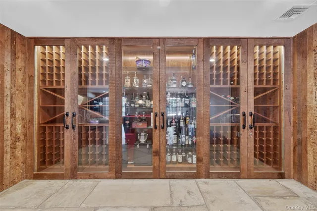 a view of a patio with a dining table and chairs under an umbrella