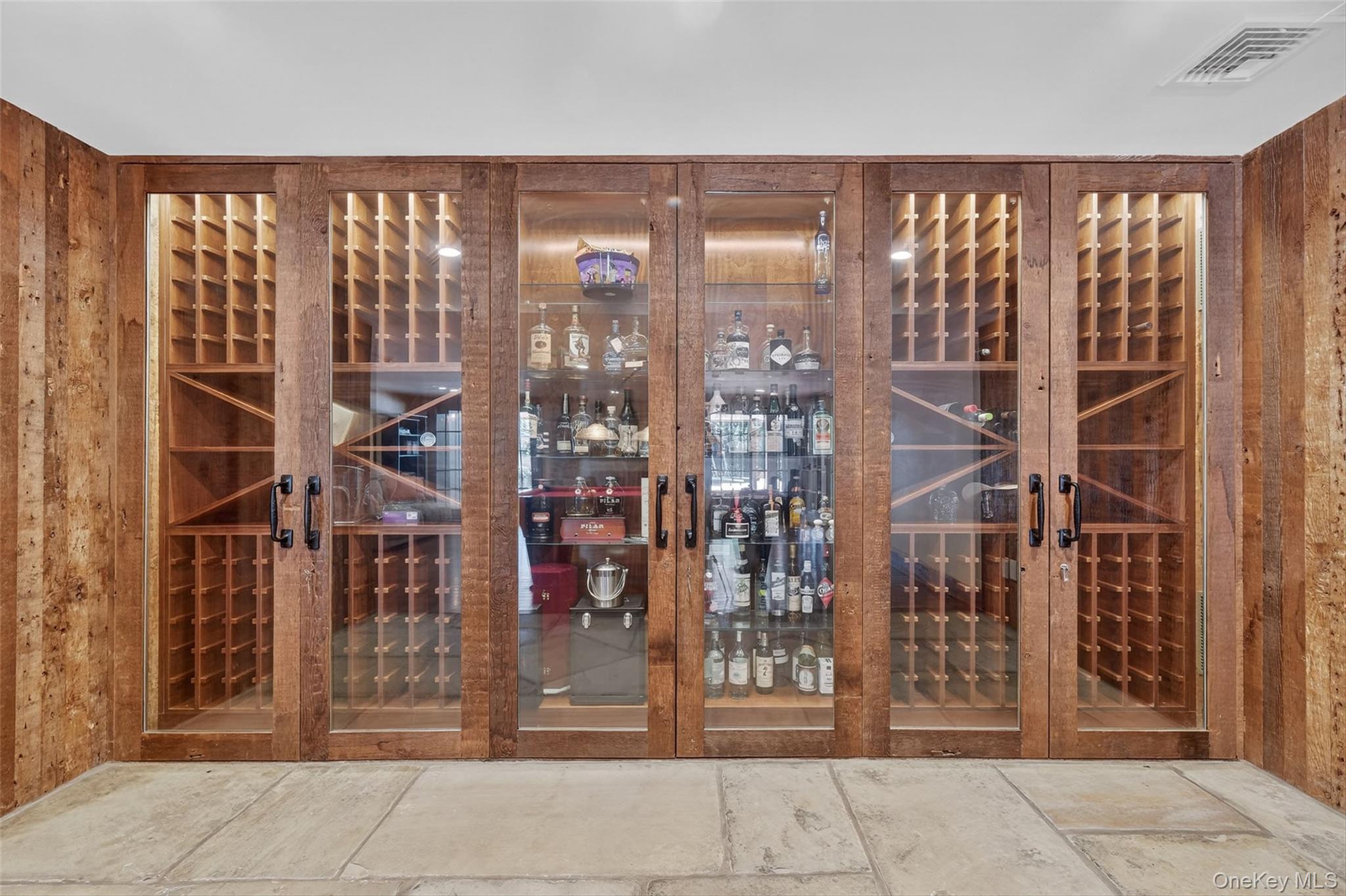 5 Stonehaven Road West Nyack, NY 10994 - Photo 33 of 50 Wine Closet featuring wood walls and stone tile floors