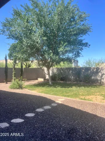 a view of a yard with a house