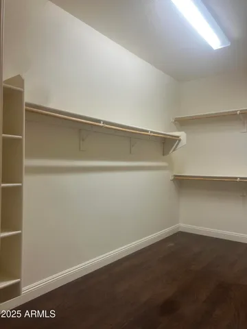 a bathroom with a sink vanity and mirror