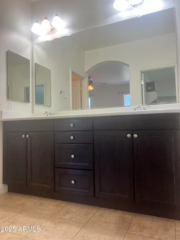 a bathroom with a sink and vanity