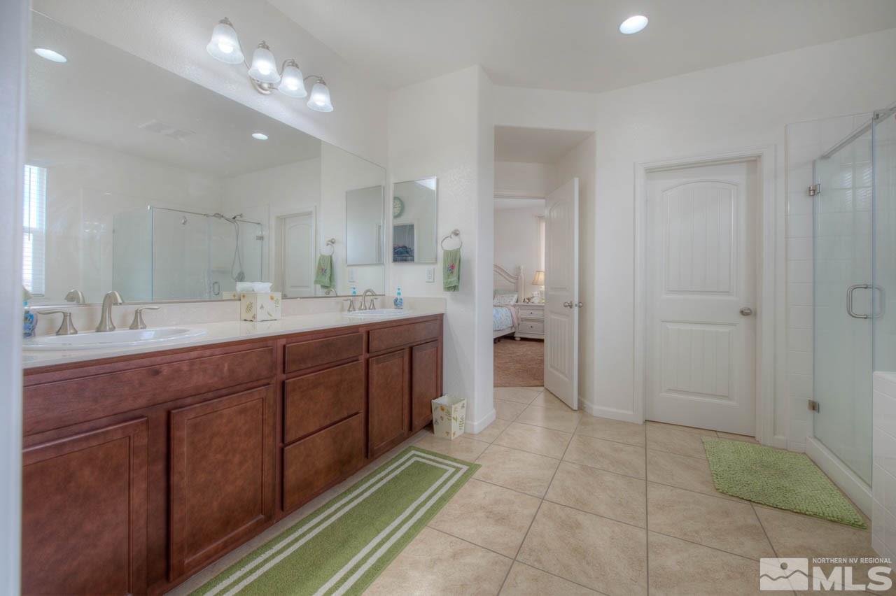 2180 Hope Valley Drive Reno, NV 89521 - Photo 11 of 21 a spacious bathroom with a double vanity sink a mirror and a shower
