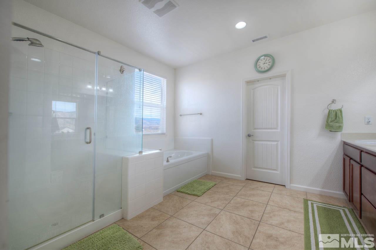2180 Hope Valley Drive Reno, NV 89521 - Photo 12 of 21 a bathroom with a bathtub and a shower