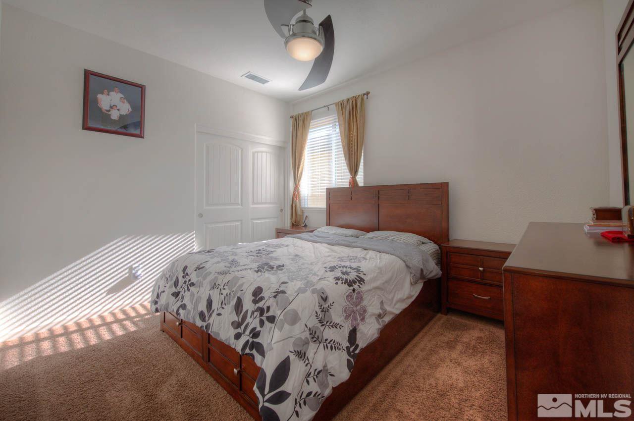 2180 Hope Valley Drive Reno, NV 89521 - Photo 13 of 21 a bedroom with a bed and a window