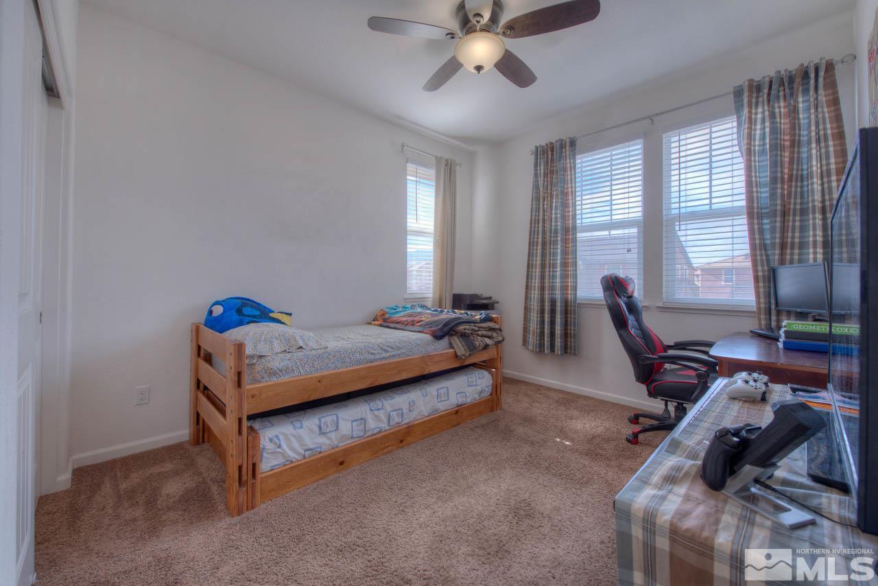 2180 Hope Valley Drive Reno, NV 89521 - Photo 14 of 21 a bedroom with furniture and large windows