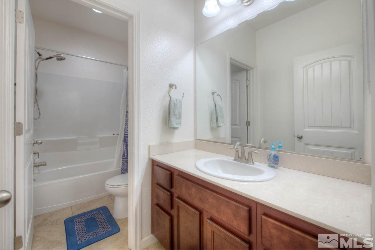 2180 Hope Valley Drive Reno, NV 89521 - Photo 16 of 21 a bathroom with a sink a toilet and shower