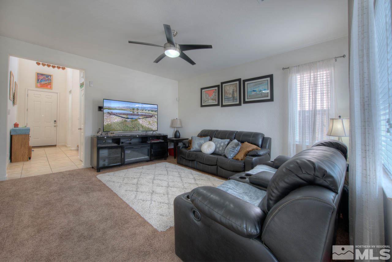 2180 Hope Valley Drive Reno, NV 89521 - Photo 4 of 21 a living room with furniture and a flat screen tv
