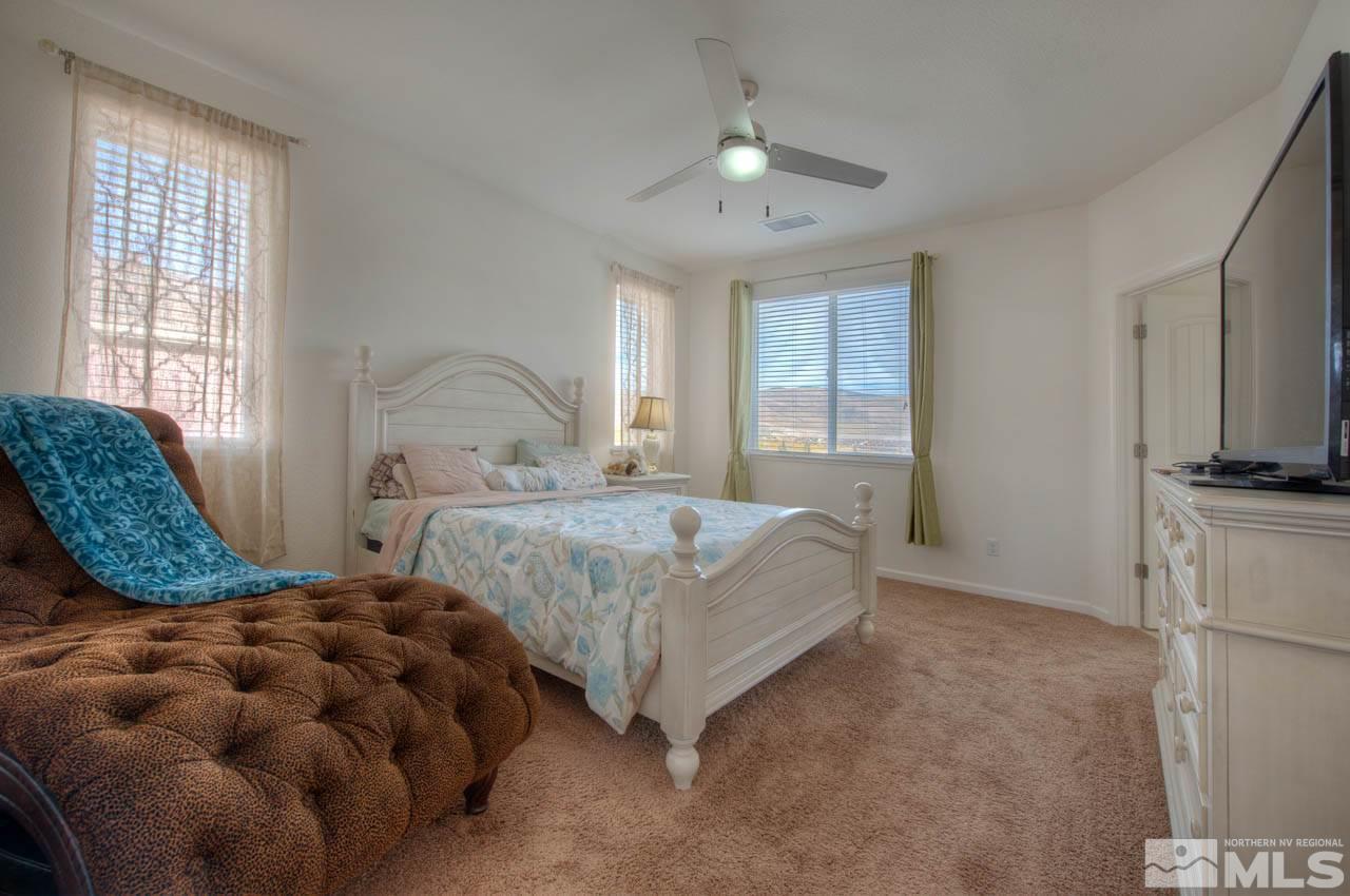 2180 Hope Valley Drive Reno, NV 89521 - Photo 9 of 21 a bedroom with bed and a chandelier