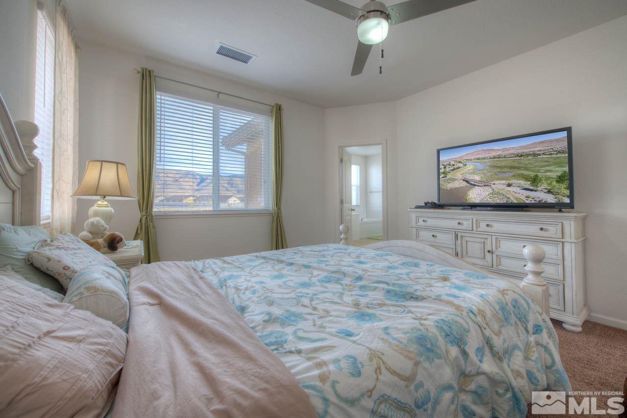 2180 Hope Valley Drive Reno, NV 89521 - Photo 10 of 21 a bedroom with a bed and a flat screen tv