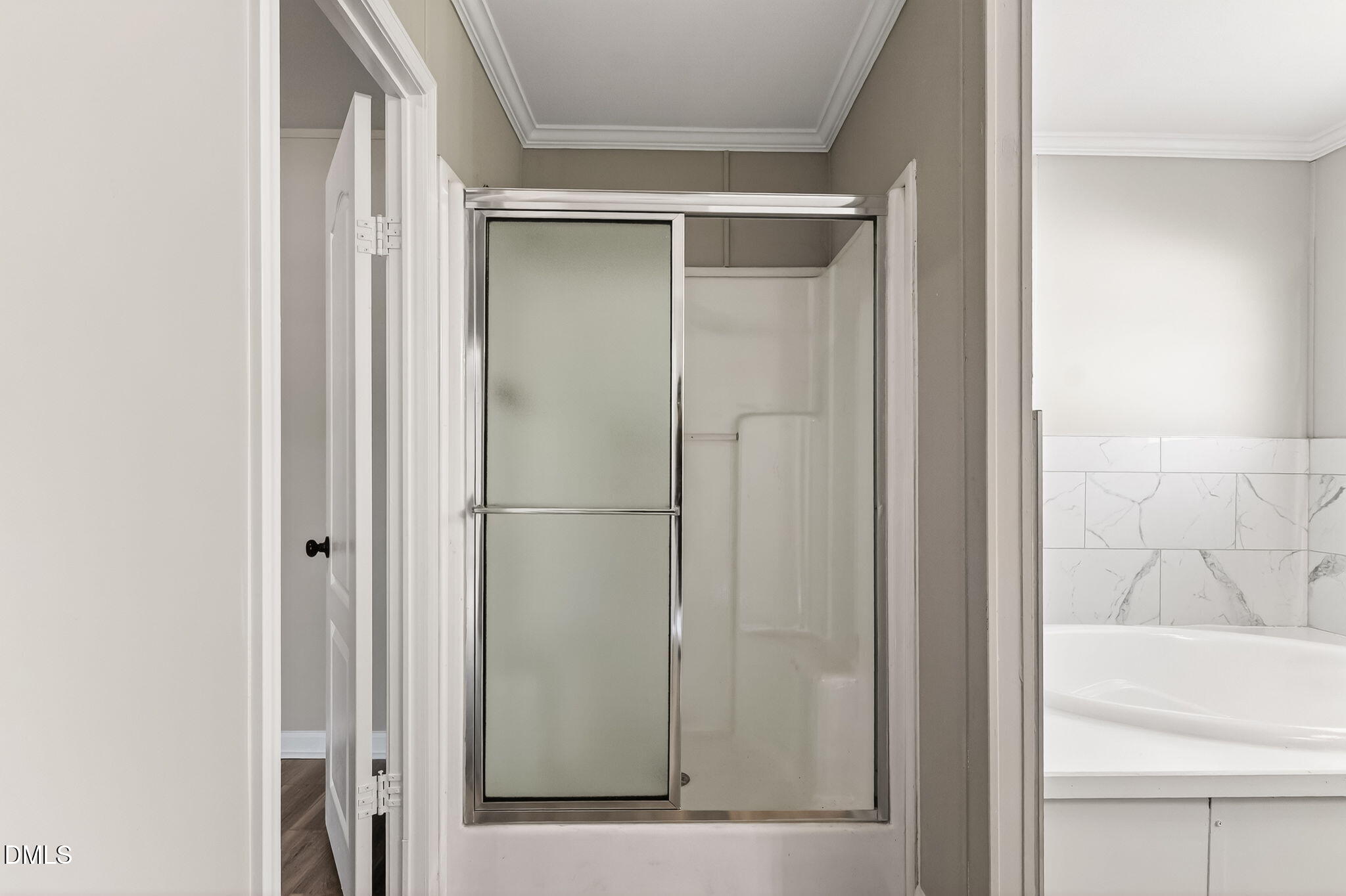10015 Smith Road Middlesex, NC 27557 - Photo 28 of 48 a bathroom with a glass shower door