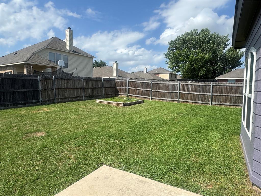 908 Cedar Ridge Lane Burleson, TX 76028 - Photo 20 of 24 a view of a garden with a slide