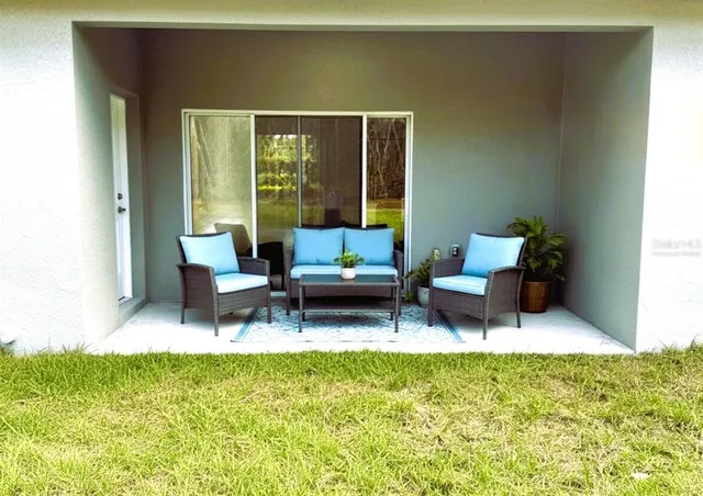 a view of a field with trees