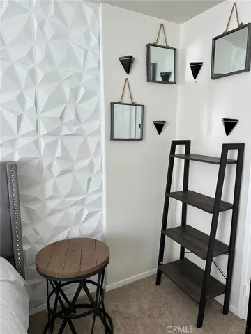 a view of a room with a table and chairs