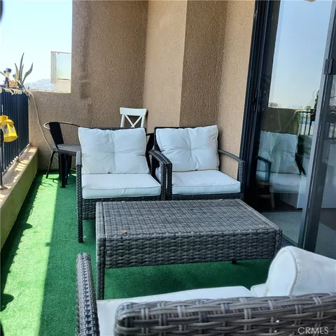 a living room with a couch and a garden