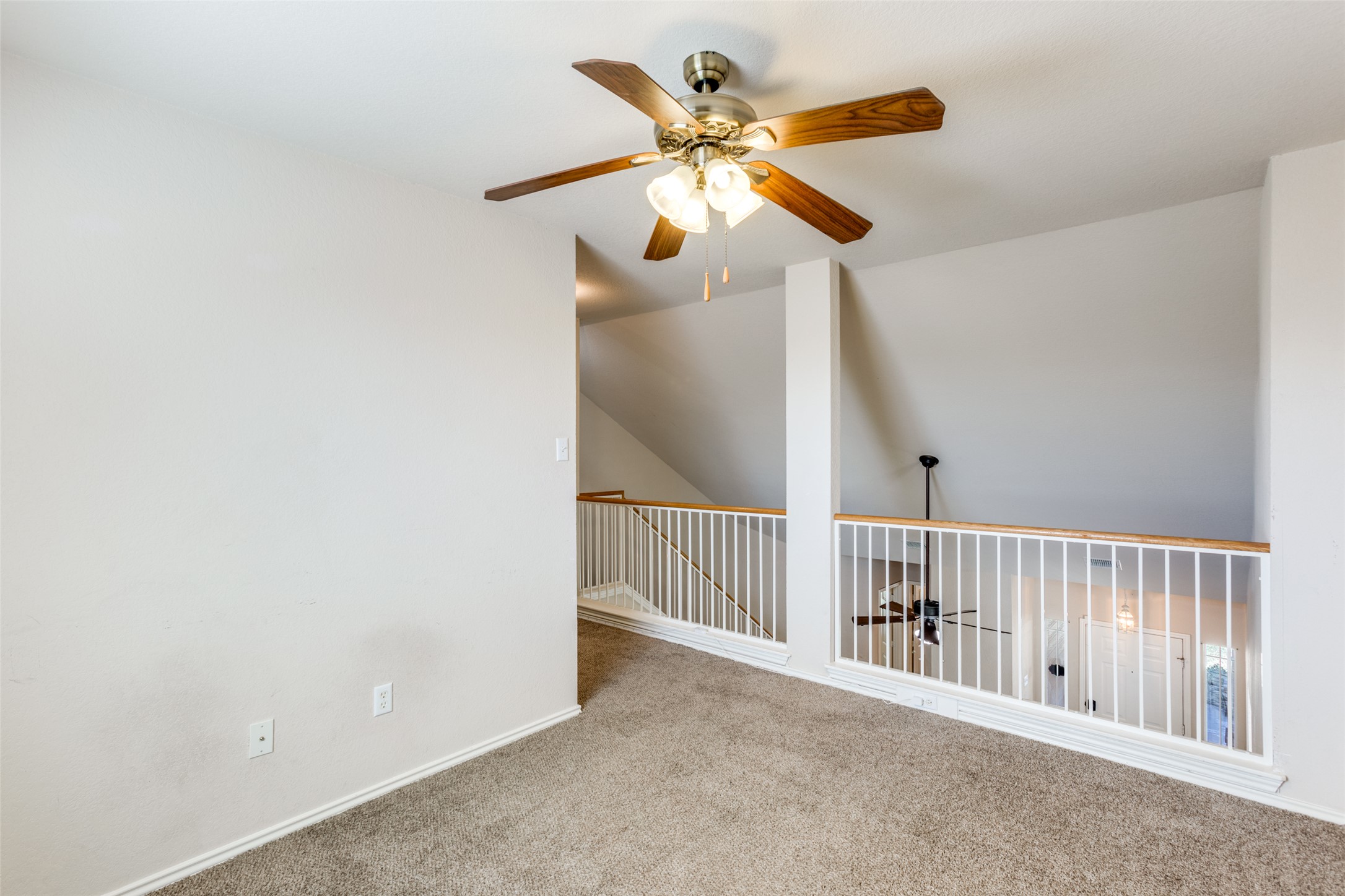 5043 Hartson Kyle, TX 78640 - Photo 17 of 30 Loft/bonus room for additional living space featuring a ceiling fan and carpet flooring