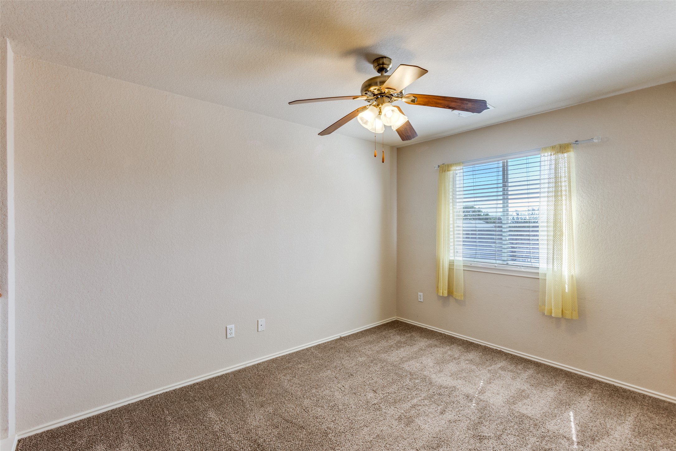 5043 Hartson Kyle, TX 78640 - Photo 18 of 30 Loft/bonus room for additional living space featuring ceiling fan and baseboards