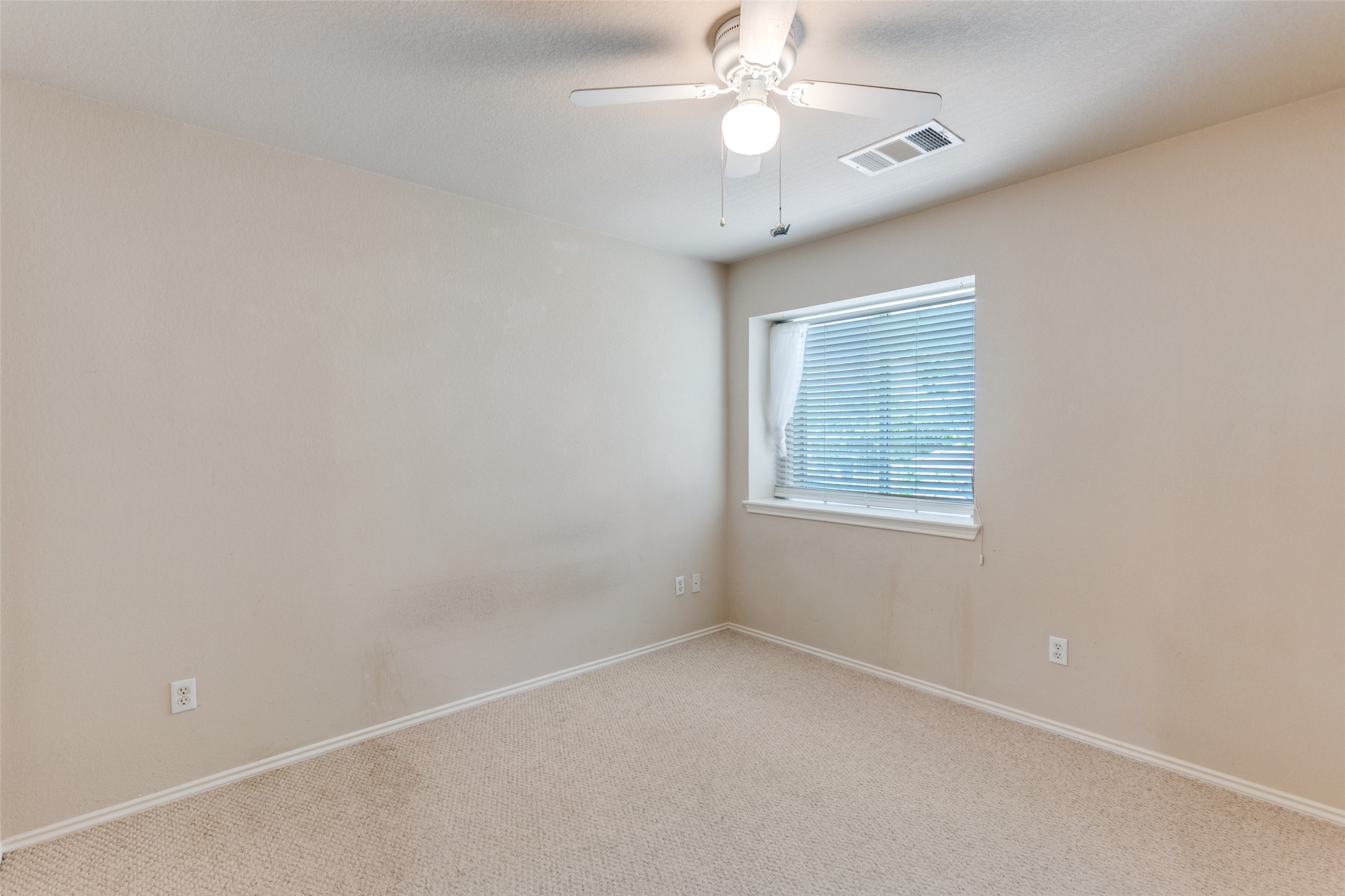 5043 Hartson Kyle, TX 78640 - Photo 19 of 30 Second bedroom with ceiling fan and baseboards