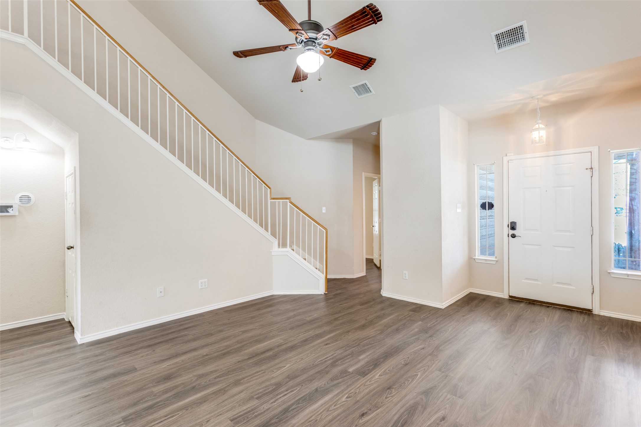 5043 Hartson Kyle, TX 78640 - Photo 6 of 30 Entrance foyer with ceiling fan and dark wood-type flooring