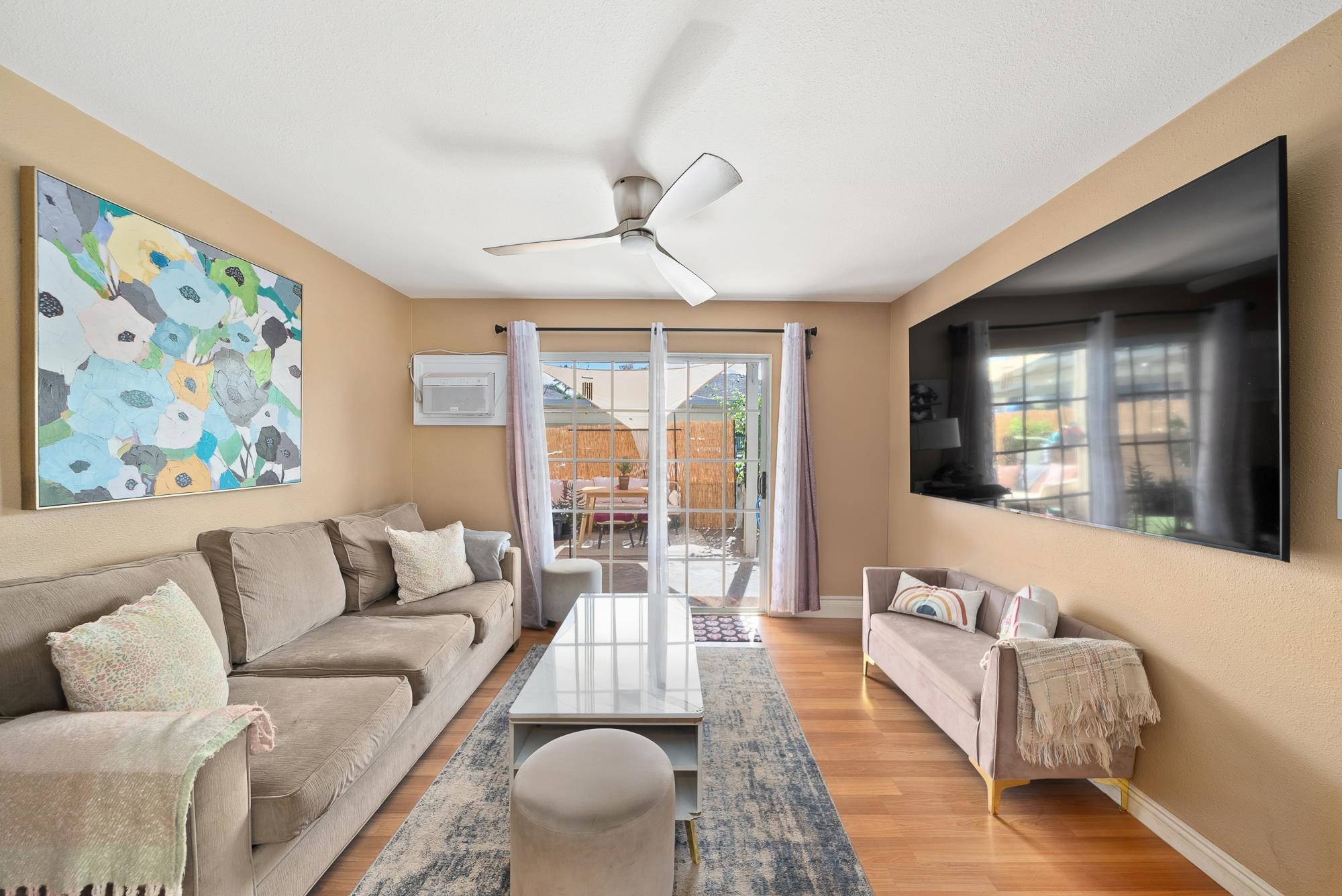 160 Keonekai Road, Unit 9101 Kihei, HI 96753 - Photo 2 of 23 a living room with furniture and a large window