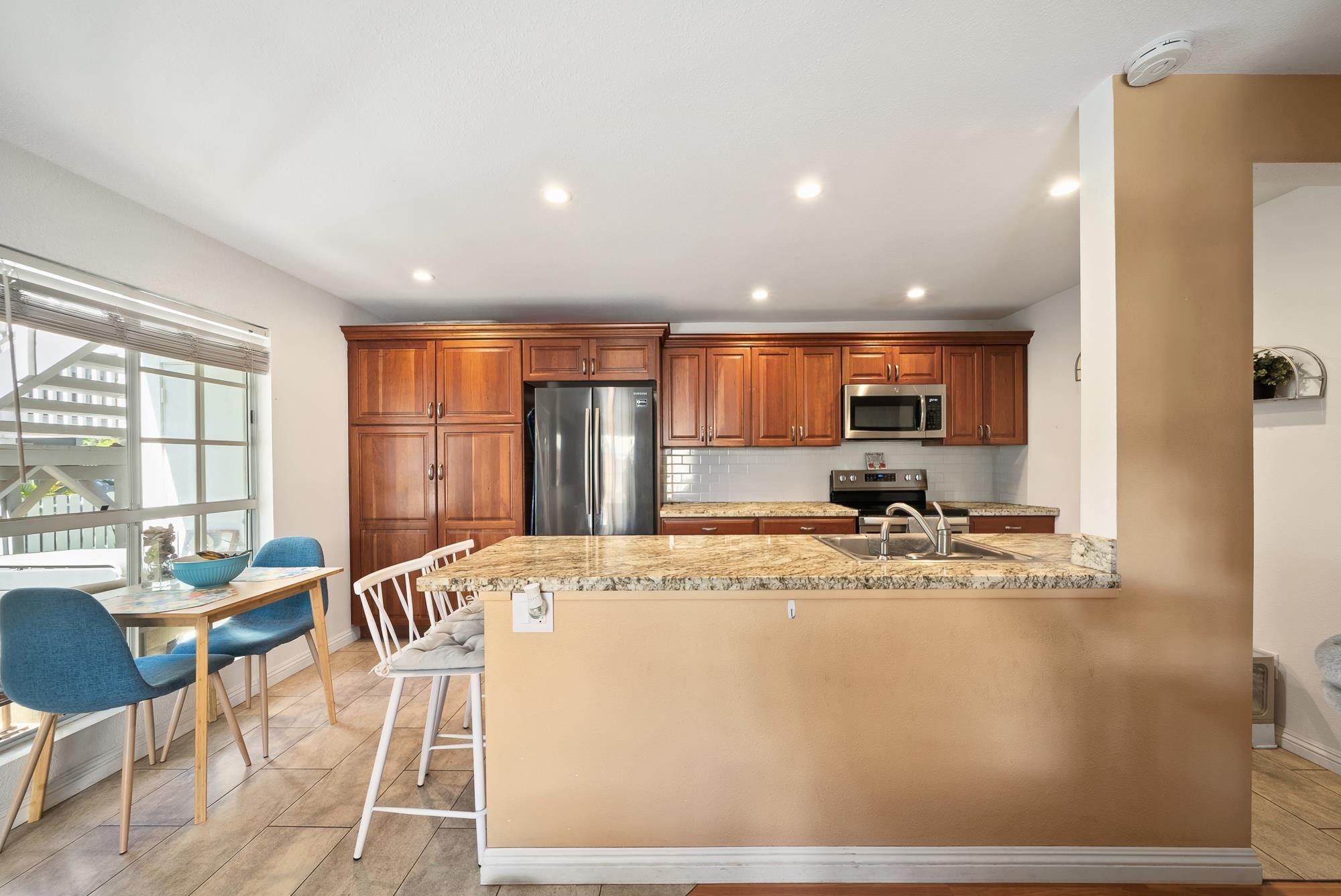 160 Keonekai Road, Unit 9101 Kihei, HI 96753 - Photo 4 of 23 a view of kitchen with stainless steel appliances granite countertop sink and cabinets