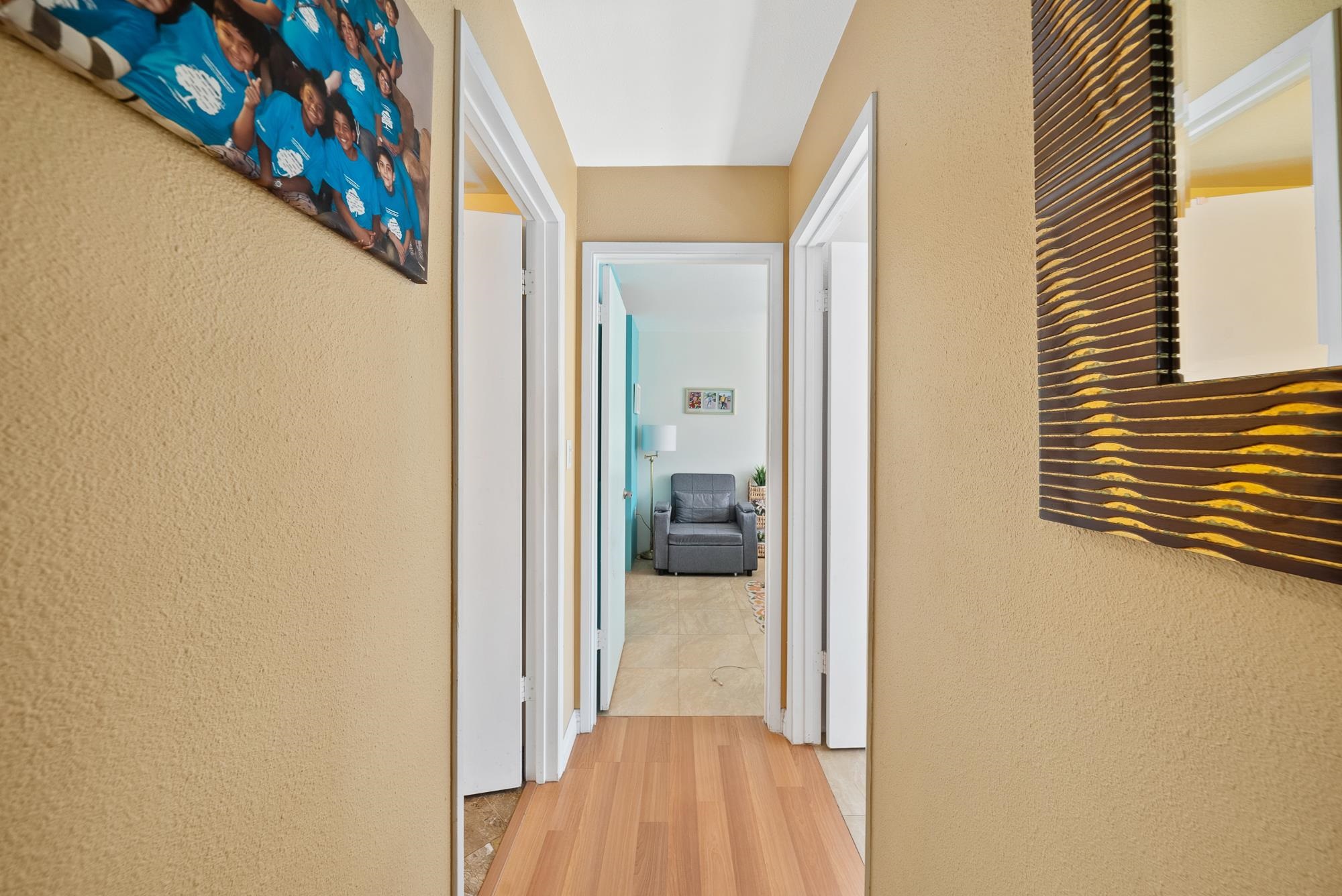 160 Keonekai Road, Unit 9101 Kihei, HI 96753 - Photo 10 of 23 a view of a hallway with wooden floor and a living room