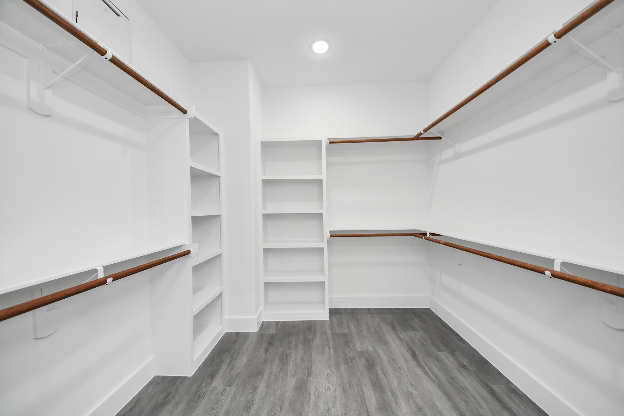 6629 Foster Street Houston, TX 77021 - Photo 26 of 33 Expansive primary closet with built in shelving and organization.