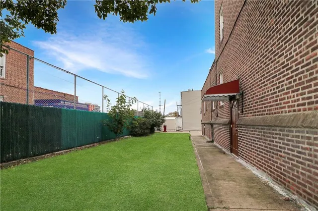 a view of a back yard of the house