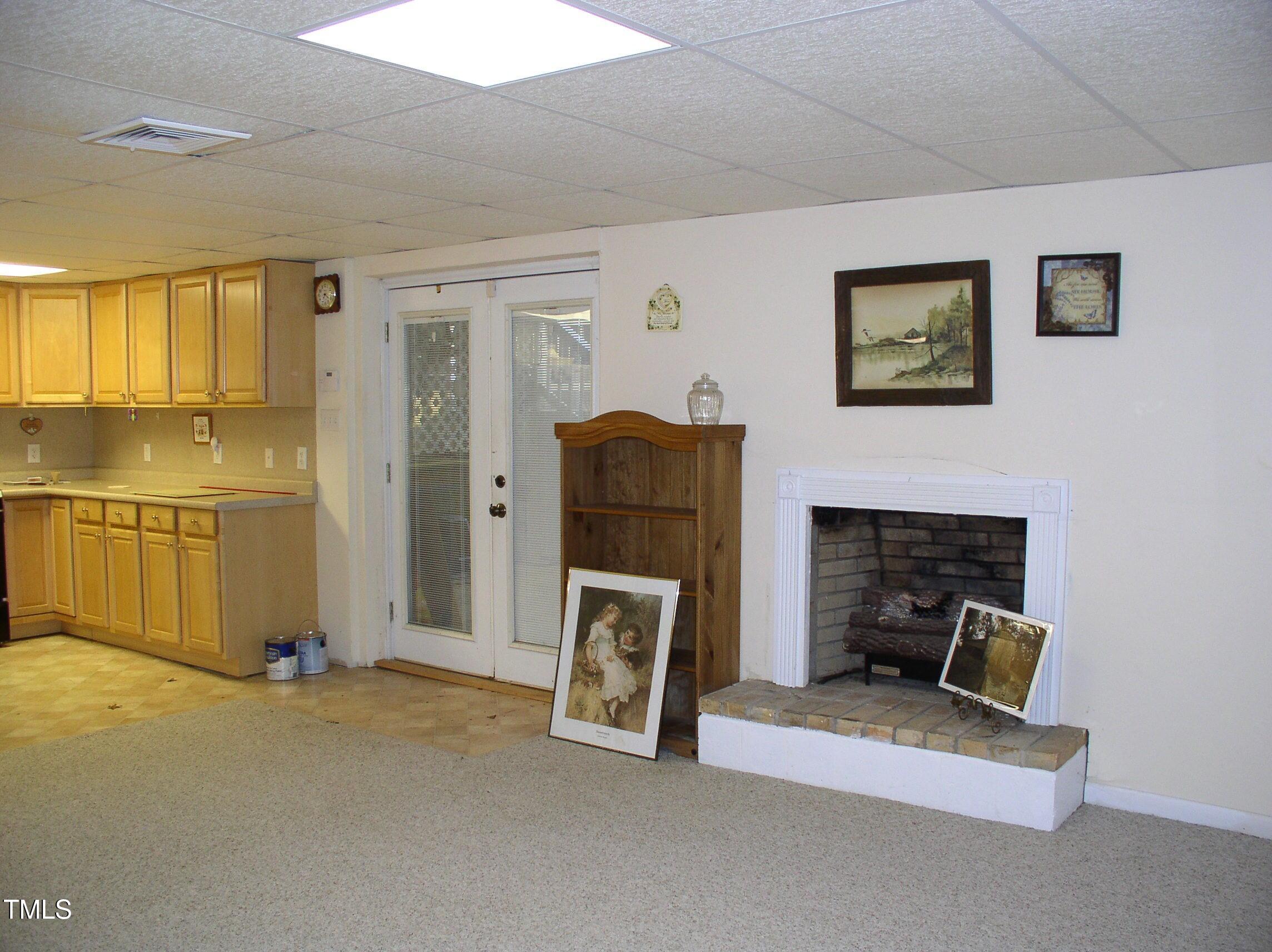 105 Lake Road Henderson, NC 27537 - Photo 31 of 51 Basement w/fireplace and gas logs