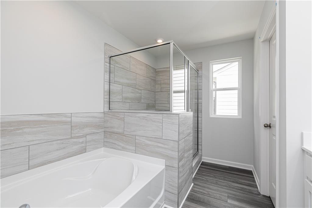 329 Cavalier Lane Acworth, GA 30102 - Photo 21 of 58 a bathroom with a bathtub and a shower