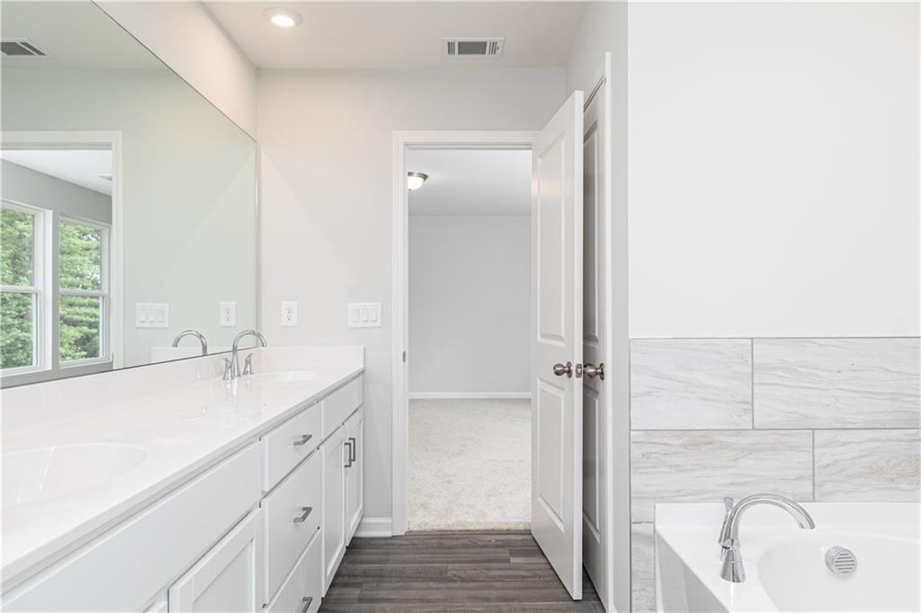 329 Cavalier Lane Acworth, GA 30102 - Photo 22 of 58 a bathroom with a sink and a bathtub