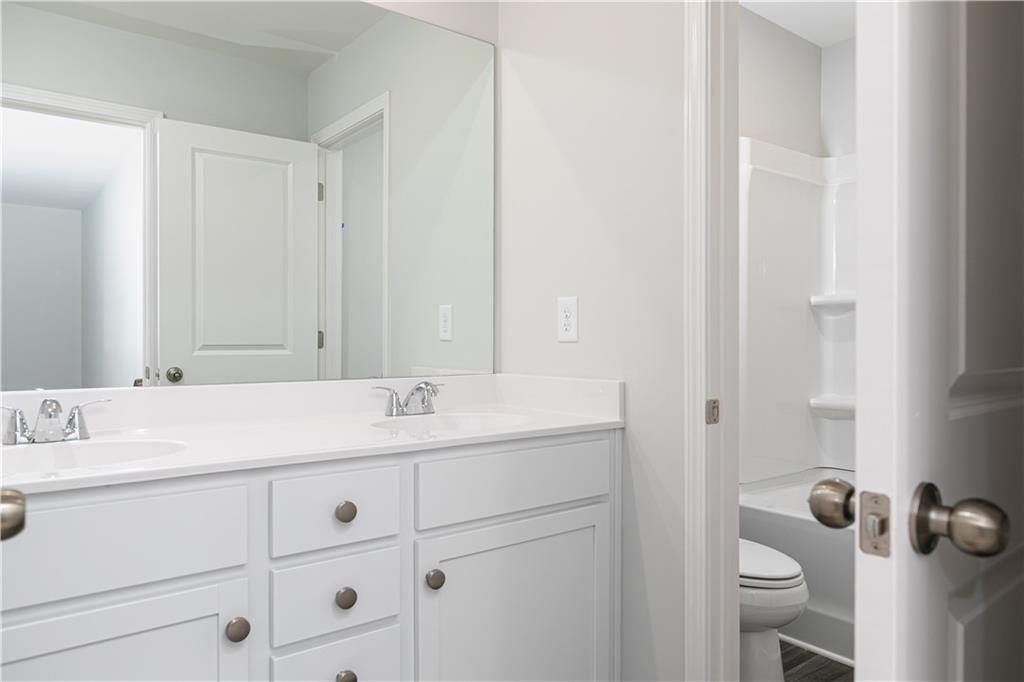 329 Cavalier Lane Acworth, GA 30102 - Photo 23 of 58 a bathroom with a sink and a mirror