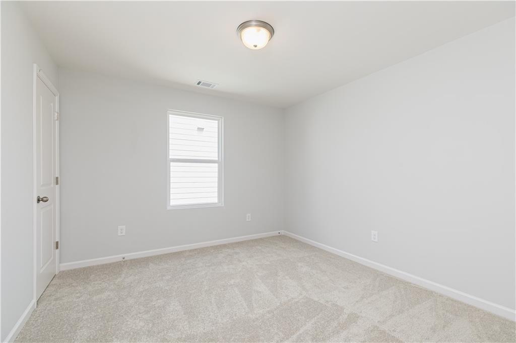 329 Cavalier Lane Acworth, GA 30102 - Photo 28 of 58 an empty room with a window and an empty room